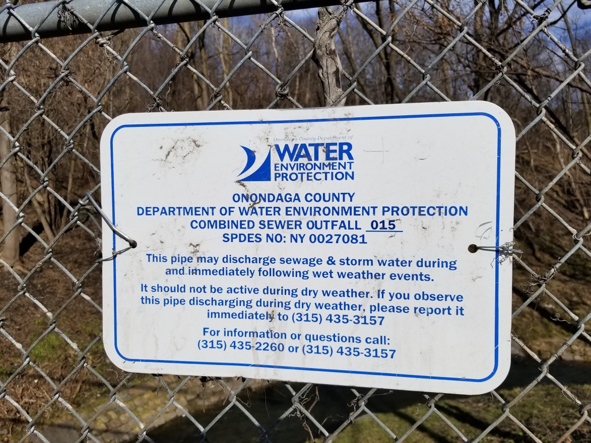 A sign warns residents of the possibility of combined sewer overflows. (Lauren Tarr)